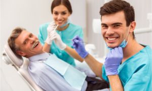 The dentists are happy to check and treat the patient's teeth.